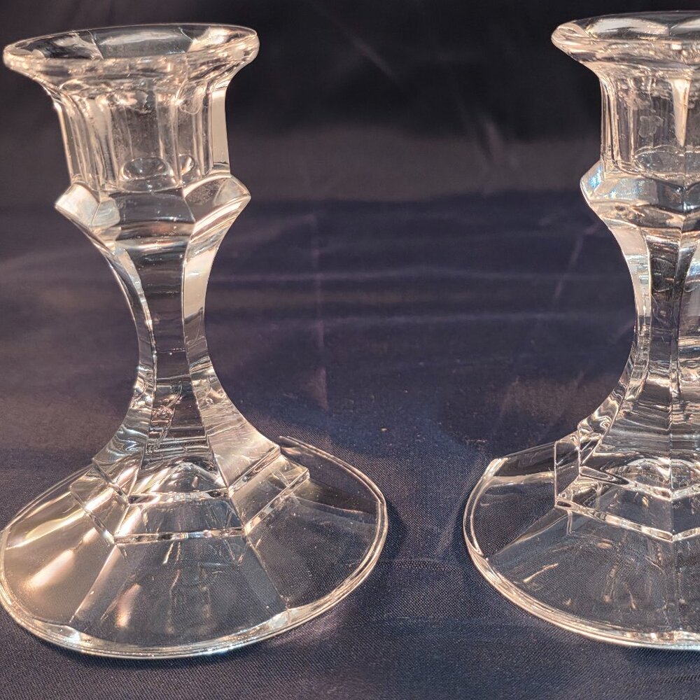A vintage clear glass faceted candlestick with a hexagonal base.